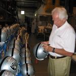 Ken SNational Sports Distributorstabler autographing helmet at 
