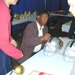 Marcus Allen autographing helmets for National Sports Distributors