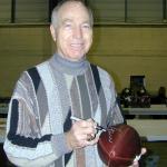 Bart Starr autographing Throwback Duke Footballs for National Sports Distributors