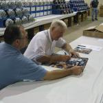 George Blanda signing photos with Robert Hemphill of National Sports Distributors