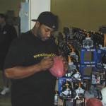 Jerome Bettis autographing footballs for National Sports Distributors