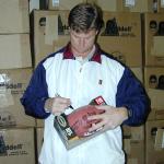 Brad Johnson sutographing footballs for National Sports Distributors