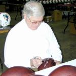 George Blanda autographing Throwback Duke Footballs for National Sports Distributors
