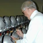 George Blanda autographing helmets for National Sports Distributors