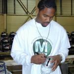 Charles Woodson autographing mini helmets for National Sports Distributors