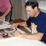 Will Clark autographing photos at his home for National Sports Distributors