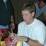 Dallas Cowboys Troy Aikman signs footballs for National Sports Distributors