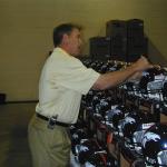 John Elway autographing helmets for National Sports Distributors