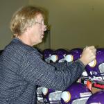 Fran Tarkenton signing helmets for National Sports Distributors