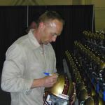 Jeff Garcia autographing helmets for National Sports Distributors