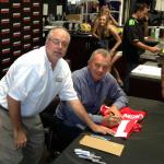 NSD President Rob Hemphill and Joe Montana working together at a Kawasaki Dealership