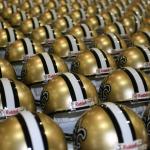 Cool shot of Saints helmets set up for signing