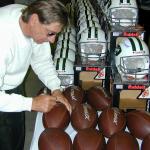Joe Namath autographing Throwback Duke Footballs for National Sports Distributors