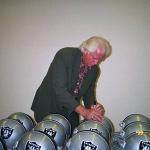 Ken Stabler autographing helmets for National Sports Distributors