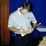 Jeff Kent autographing bats for National Sports Distributors