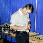 Jeff Kent signing bats for National Sports Distributors