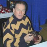 Len Dawson autographing Throwback Duke Footballs for National Sports Distributors