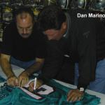 Dan Marino working with NSD President Rob Hemphill autographing jerseys for National Sports Distributors