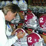 Joe Namath signing helmets for National Sports Distributors