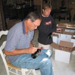 Dwight Clark autographing wine for National Sports Distributors