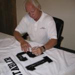 Ken Stabler autographs jerseys for National Sports Distributors