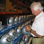 The Snake Ken Stabler autographing Raider Helmets for National Sports Distributors