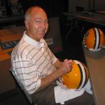 Bart Starr autographing helmets for National Sports Distributors