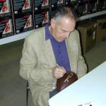 Otto Graham autographing Throwback Duke Footballs for National Sports Distributors