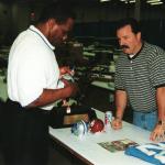 Billy Sims autographs items for National Sports Distributors