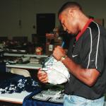 Darren Woodson autographing for National Sports Distributors