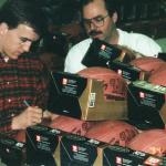 Peyton Manning autographing footballs for National Sports Distributors