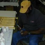 Dave Parker autographing baseballs for National Sports Distributors