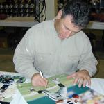 Rich Gannon autographing 16x20 photos for National Sports Distributors