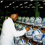 Barry Sanders signing helmets for National Sports Distributors