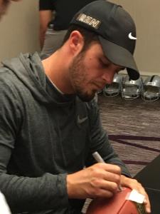 Raiders Derek Carr Signing NFL Game Footballs for NSD