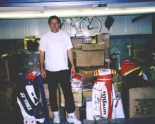 Joe Montana in his garage with items for National Sports Distributors