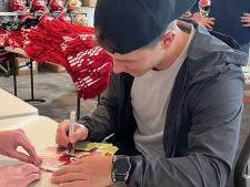 Brock Purdy Autograping 8x10 photos for National Sports Distributors